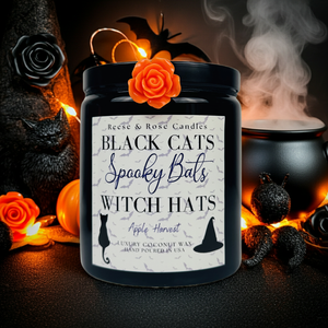 Candle with Halloween-themed label surrounded by decorative elements on a dark background