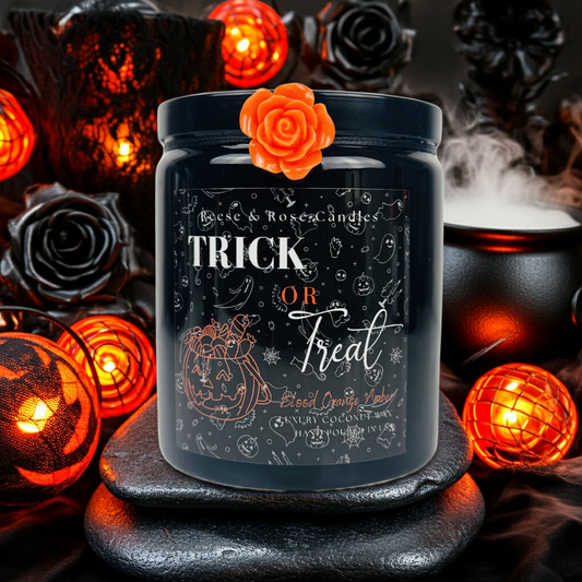 Halloween-themed candle with decorative elements on a dark background