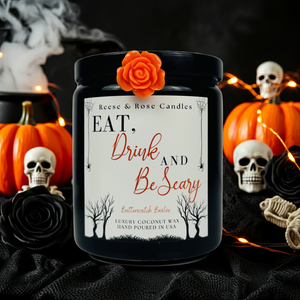 Halloween-themed candle with decorative elements and text on a dark background