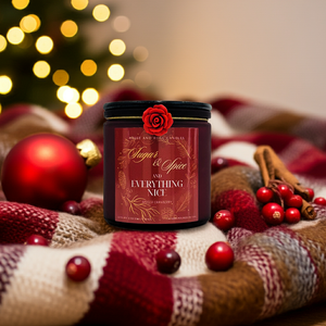 Candle jar labeled 'Sugar & Spice and Everything Nice' with Christmas decorations on a plaid fabric.