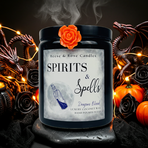 Candle labeled 'Spirits & Spells' with decorative elements on a dark background